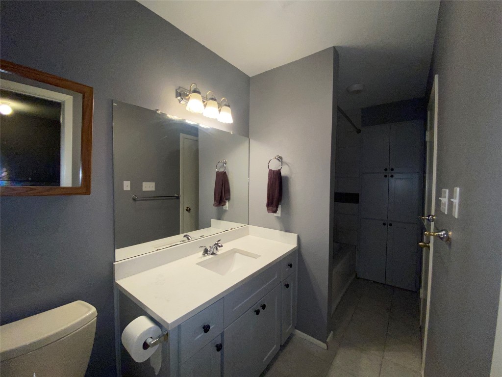 4204 Hudson Bend Road, Unit A Austin, TX 78734 - Photo 15 of 15 a bathroom with a sink toilet and mirror