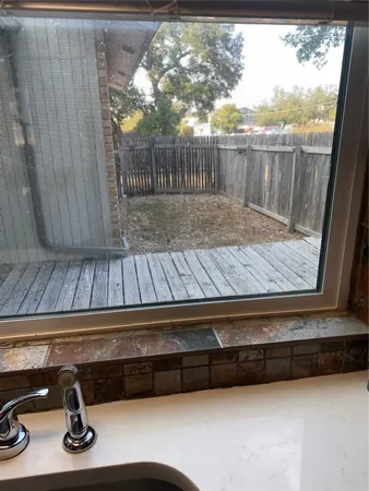 a view of backyard with wooden floor
