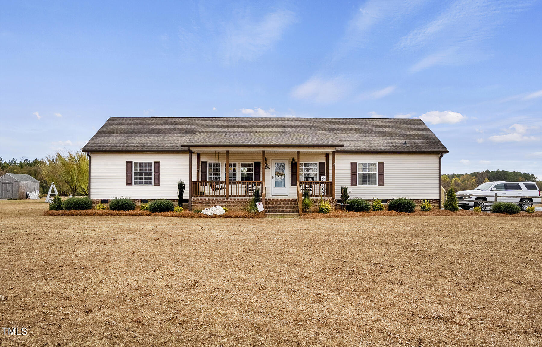 1645 Denning Road Benson, NC 27504 - Photo 1 of 17 a house view with a sitting space and garden