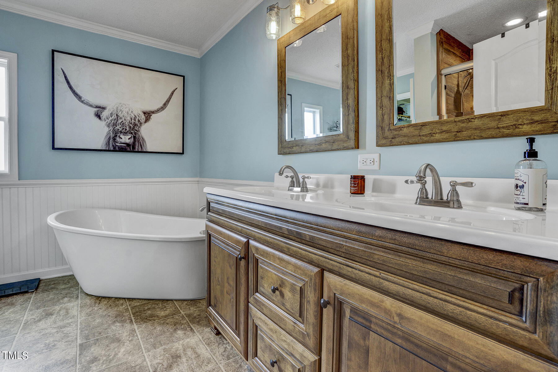 1645 Denning Road Benson, NC 27504 - Photo 7 of 17 a bathroom with a sink and a mirror