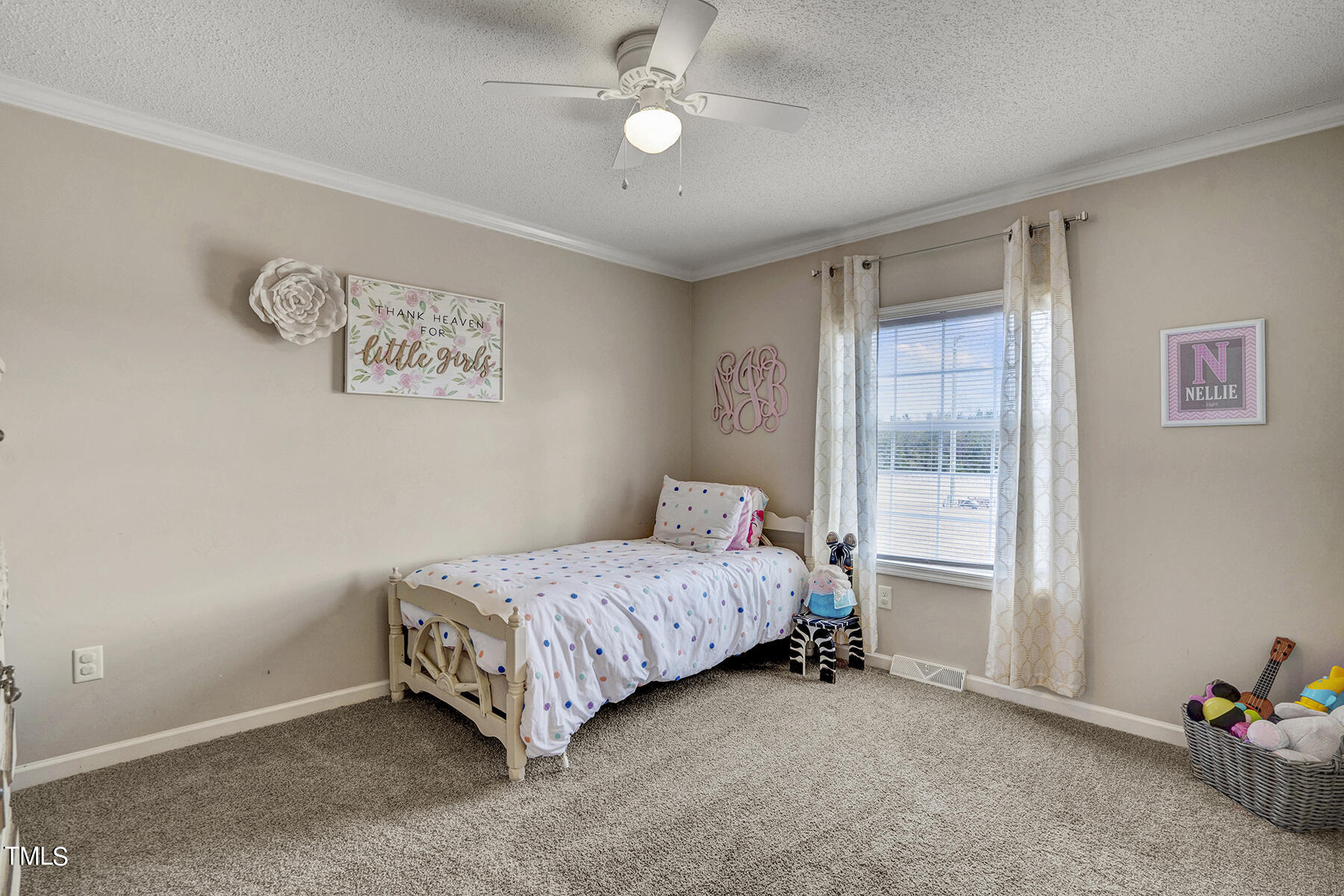1645 Denning Road Benson, NC 27504 - Photo 9 of 17 a bedroom with a bed and a chandelier