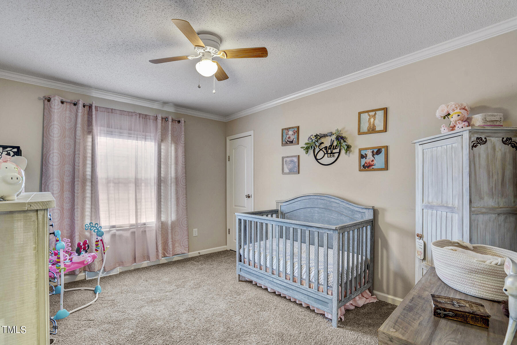 1645 Denning Road Benson, NC 27504 - Photo 10 of 17 a bedroom with a bed and a window