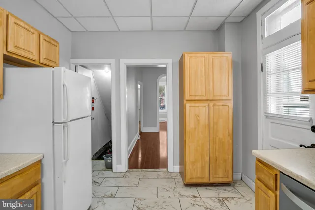 a view of a bathroom with a shower and a sink