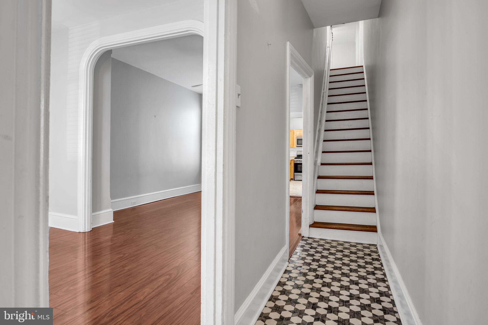 211 Cumberland Street Harrisburg, PA 17102 - Photo 6 of 26 a view of a room with stairs and wooden floor
