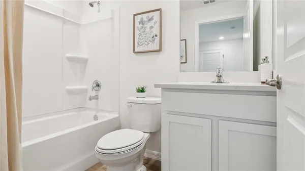 a bathroom with a sink toilet and bathtub