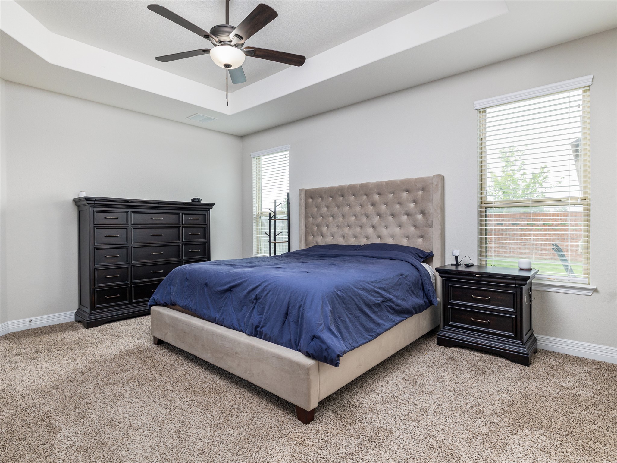 717 Blue Agave Lane Georgetown, TX 78626 - Photo 16 of 28 a spacious bedroom with a bed and ceiling fan