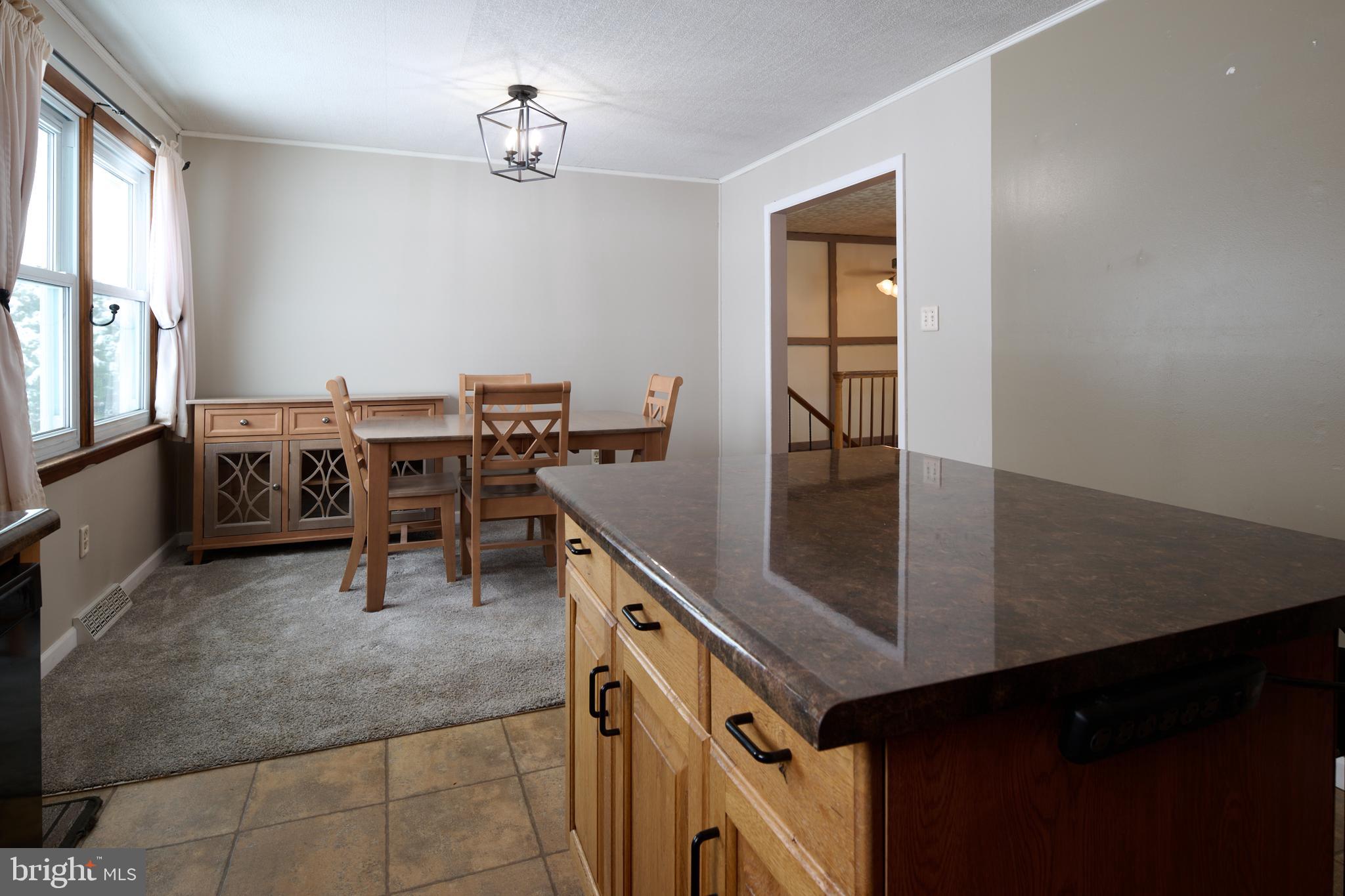 574 Buffalo Run Road Bellefonte, PA 16823 - Photo 11 of 54 a dining room with furniture and window