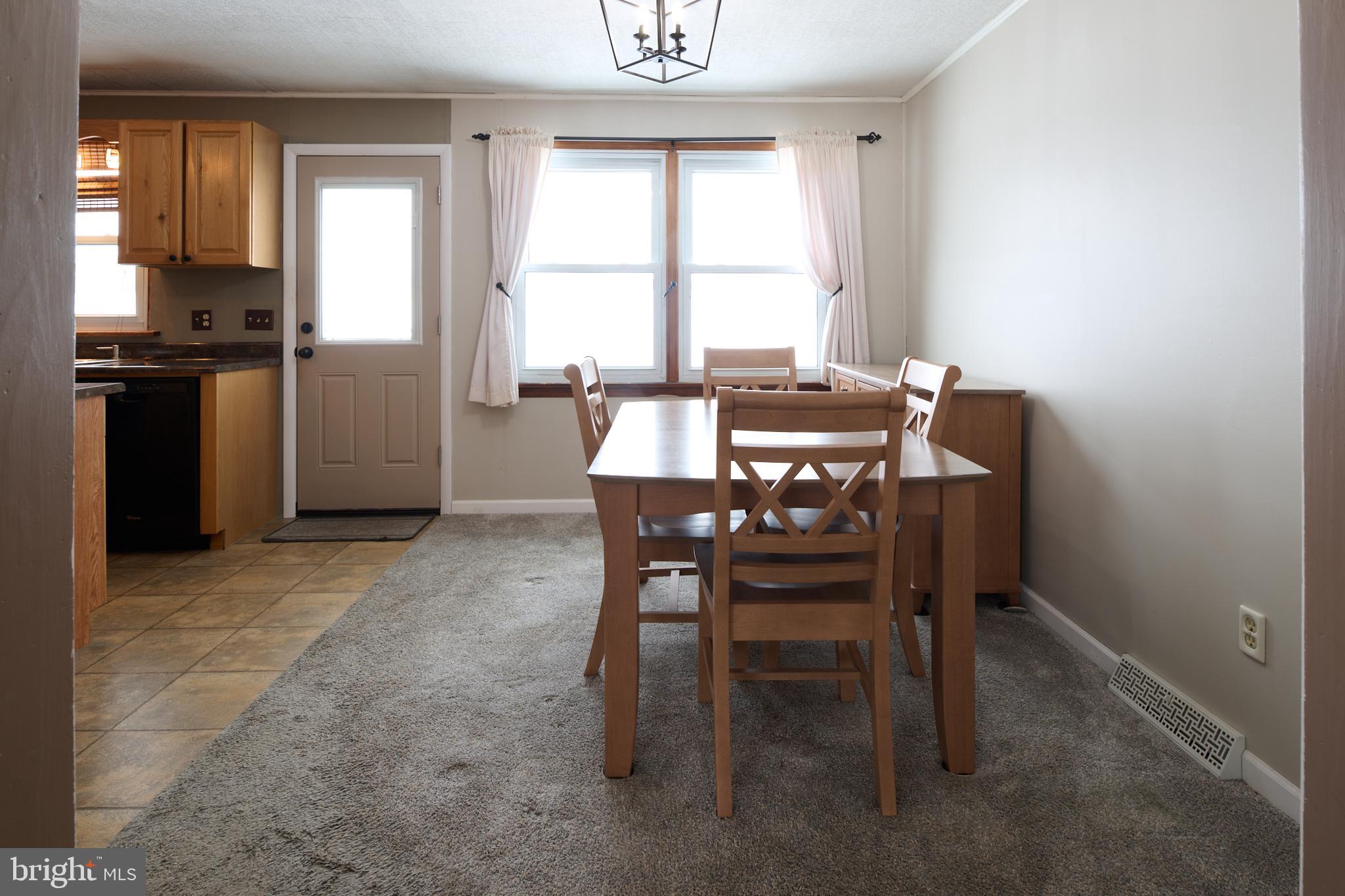 574 Buffalo Run Road Bellefonte, PA 16823 - Photo 12 of 54 a view of a dining room with furniture and a window
