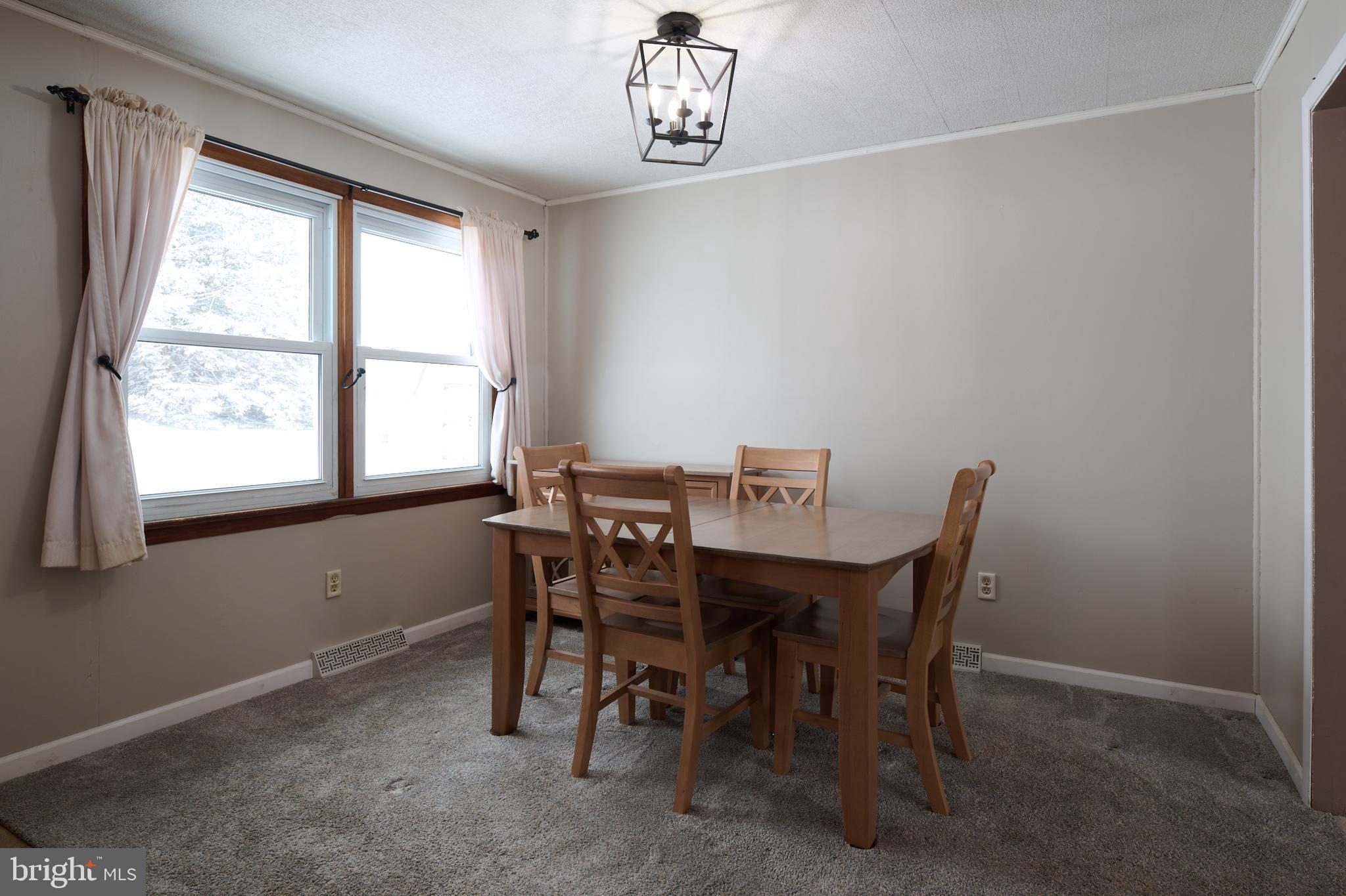 574 Buffalo Run Road Bellefonte, PA 16823 - Photo 13 of 54 a view of a dining room with furniture and window