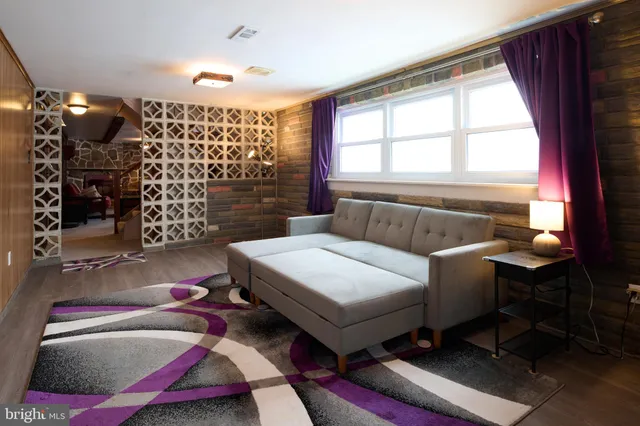 a living room with furniture and shower