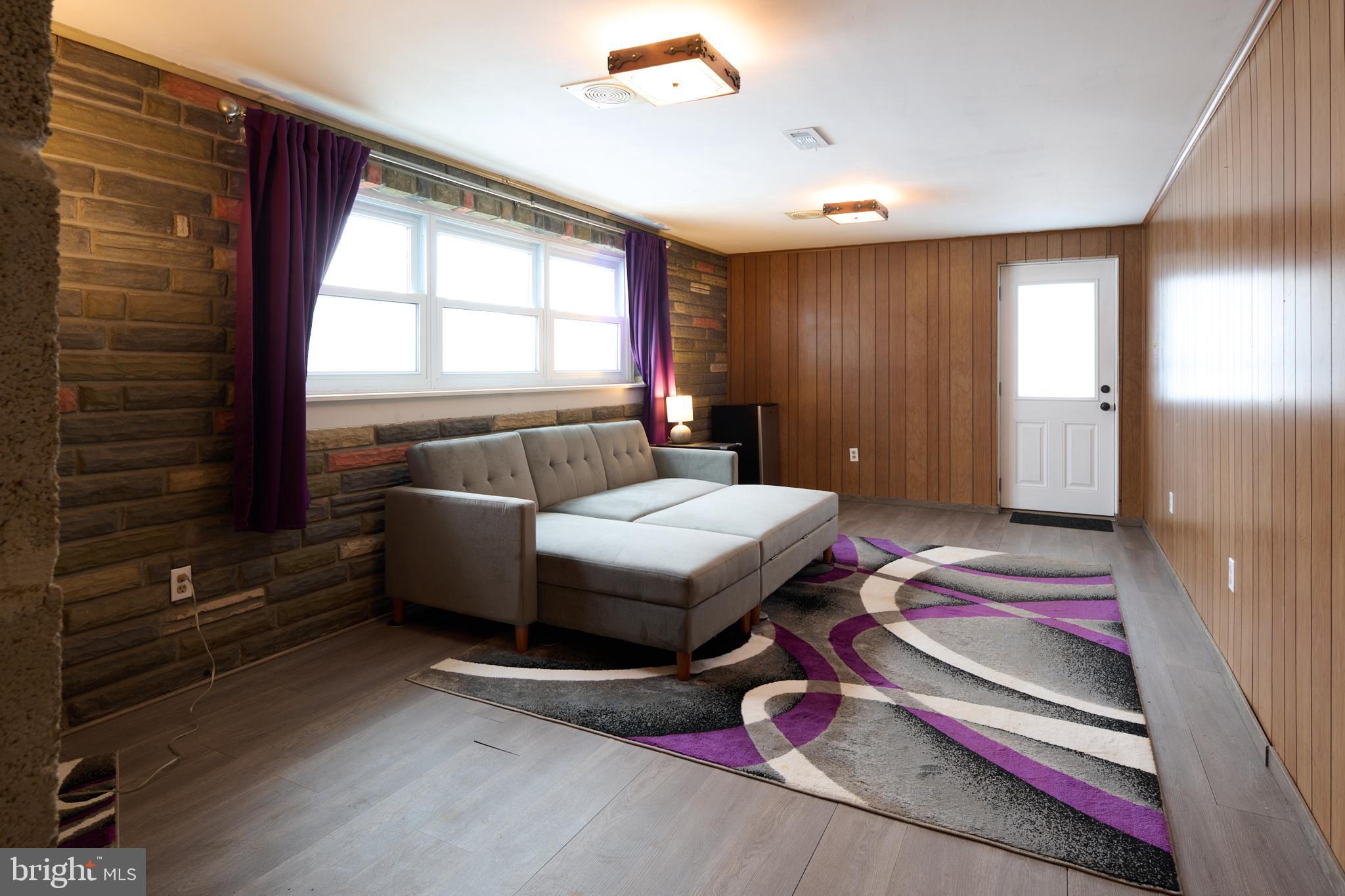 574 Buffalo Run Road Bellefonte, PA 16823 - Photo 16 of 54 a bedroom with a bed and a flat tv screen on dresser