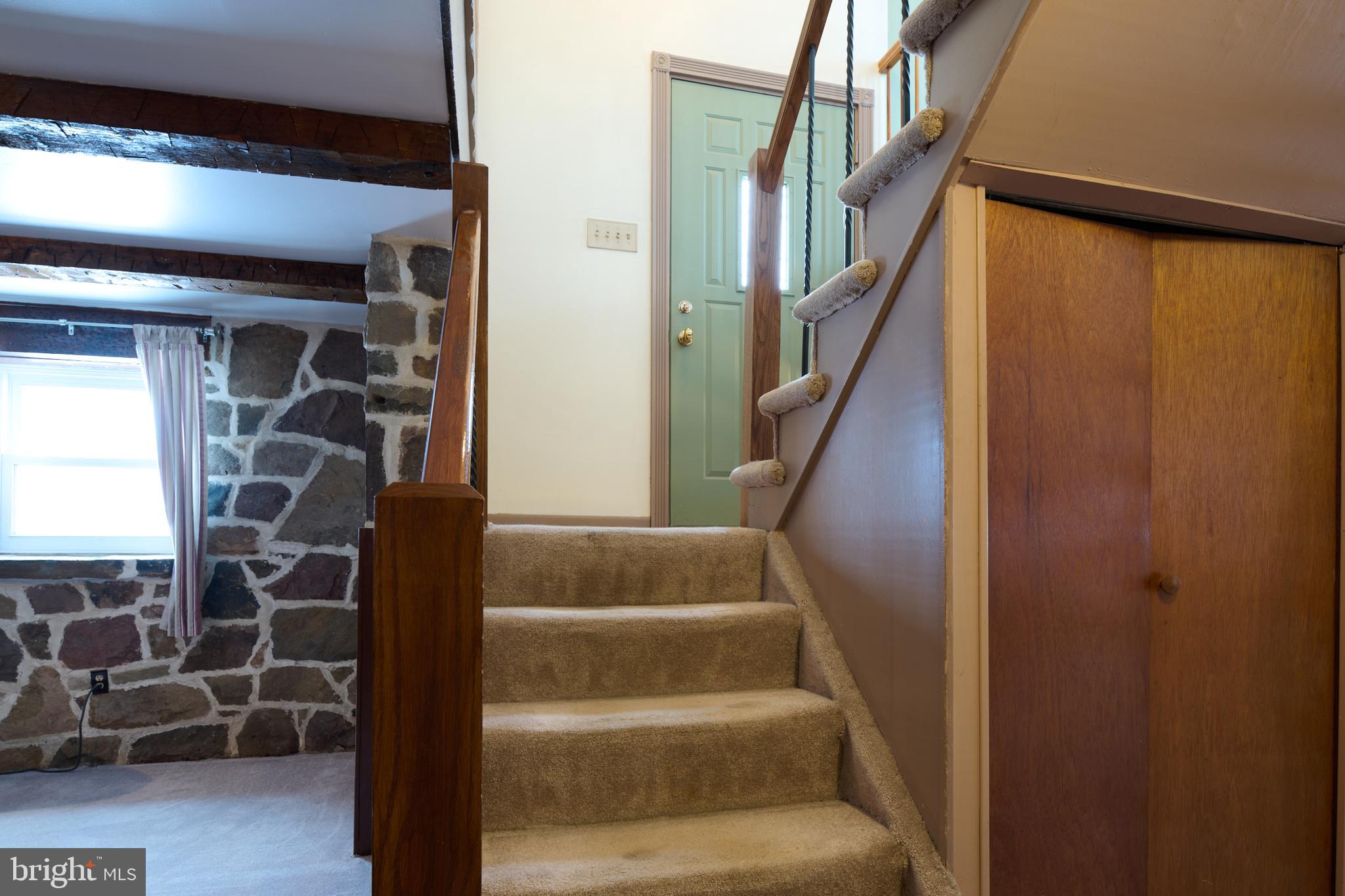 574 Buffalo Run Road Bellefonte, PA 16823 - Photo 17 of 54 a view of entryway and hall with wooden floor