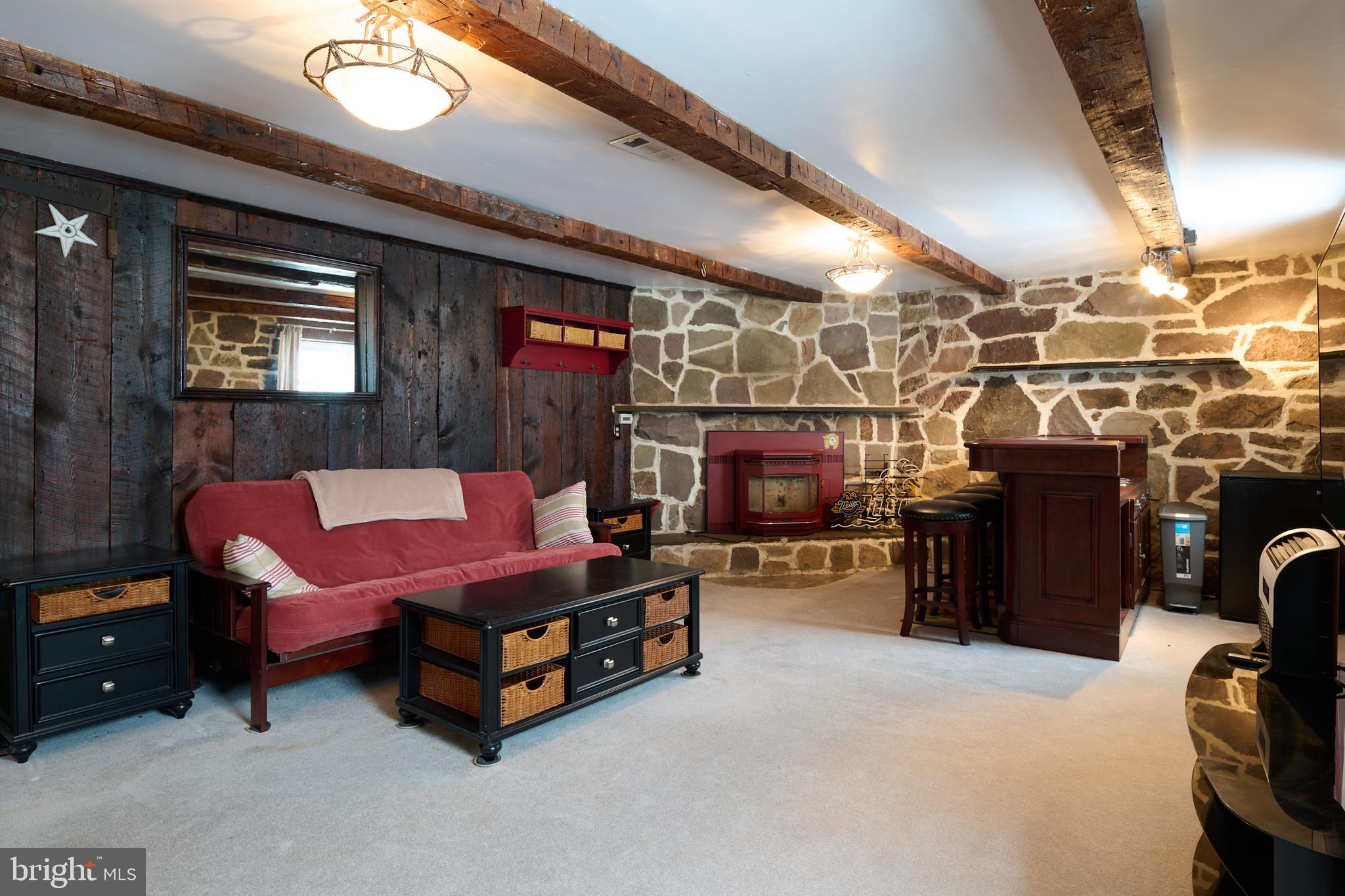 574 Buffalo Run Road Bellefonte, PA 16823 - Photo 20 of 54 a living room with furniture and a fireplace