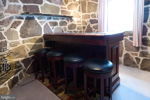 a view of an empty room with windows