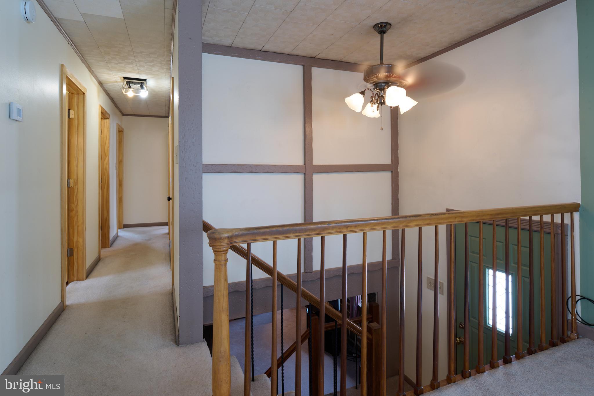 574 Buffalo Run Road Bellefonte, PA 16823 - Photo 26 of 54 a view of a hallway with a chandelier