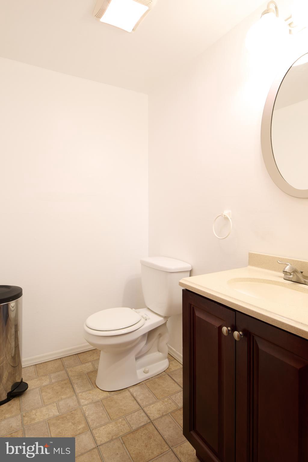 574 Buffalo Run Road Bellefonte, PA 16823 - Photo 27 of 54 a bathroom with a granite countertop toilet and a sink