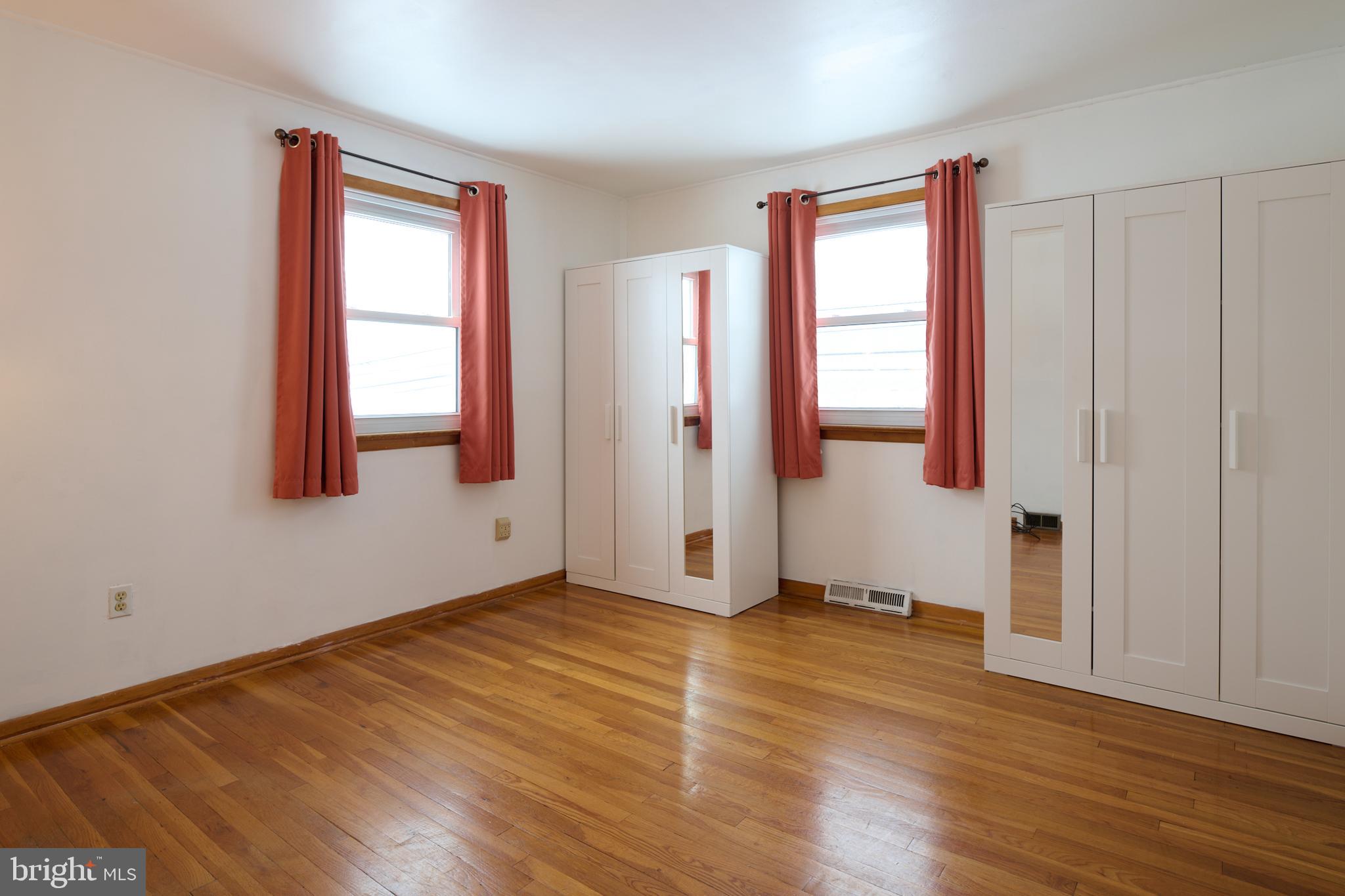 574 Buffalo Run Road Bellefonte, PA 16823 - Photo 36 of 54 an empty room with wooden floor and windows