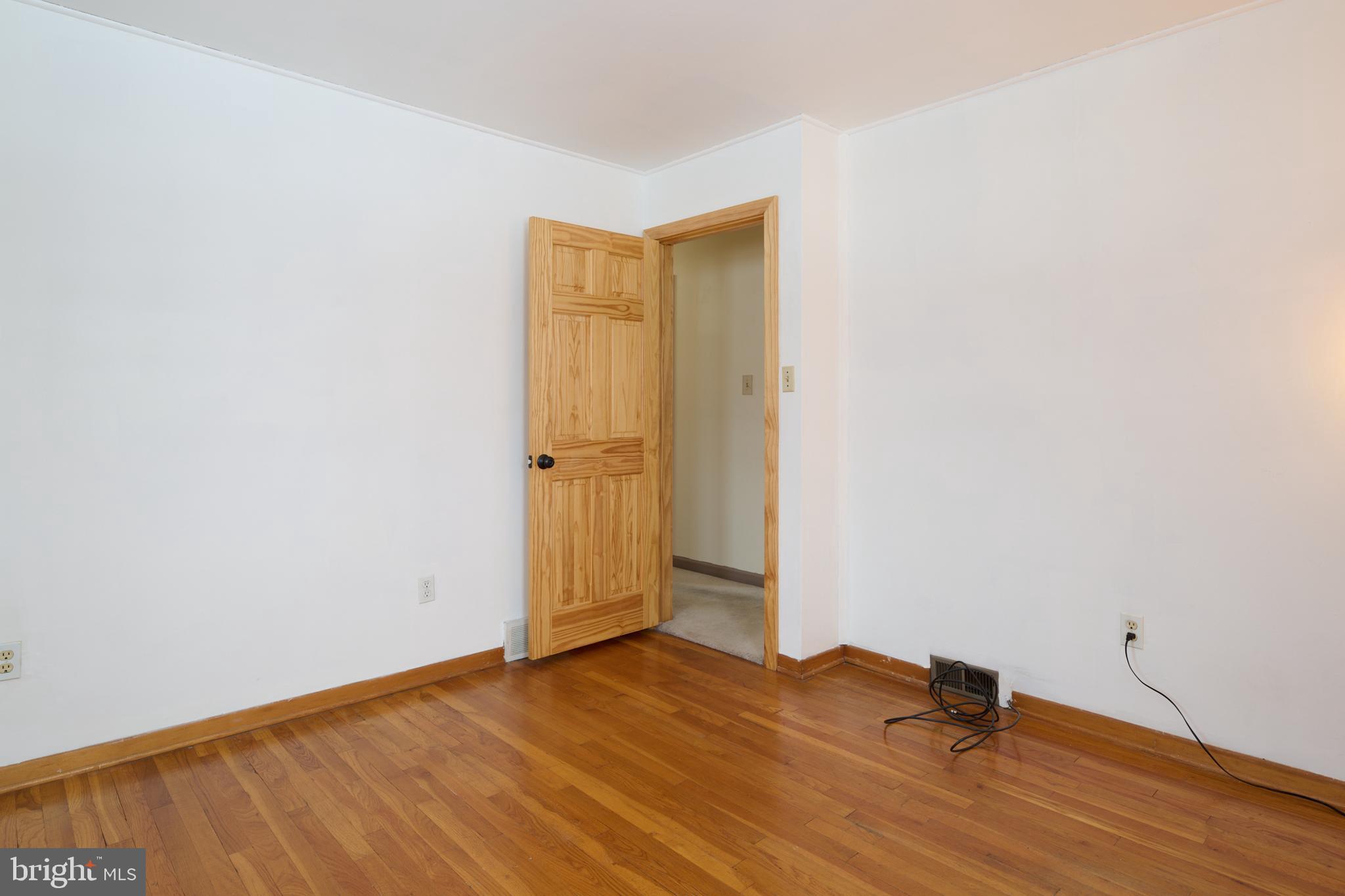 574 Buffalo Run Road Bellefonte, PA 16823 - Photo 38 of 54 a view of empty room with wooden floor
