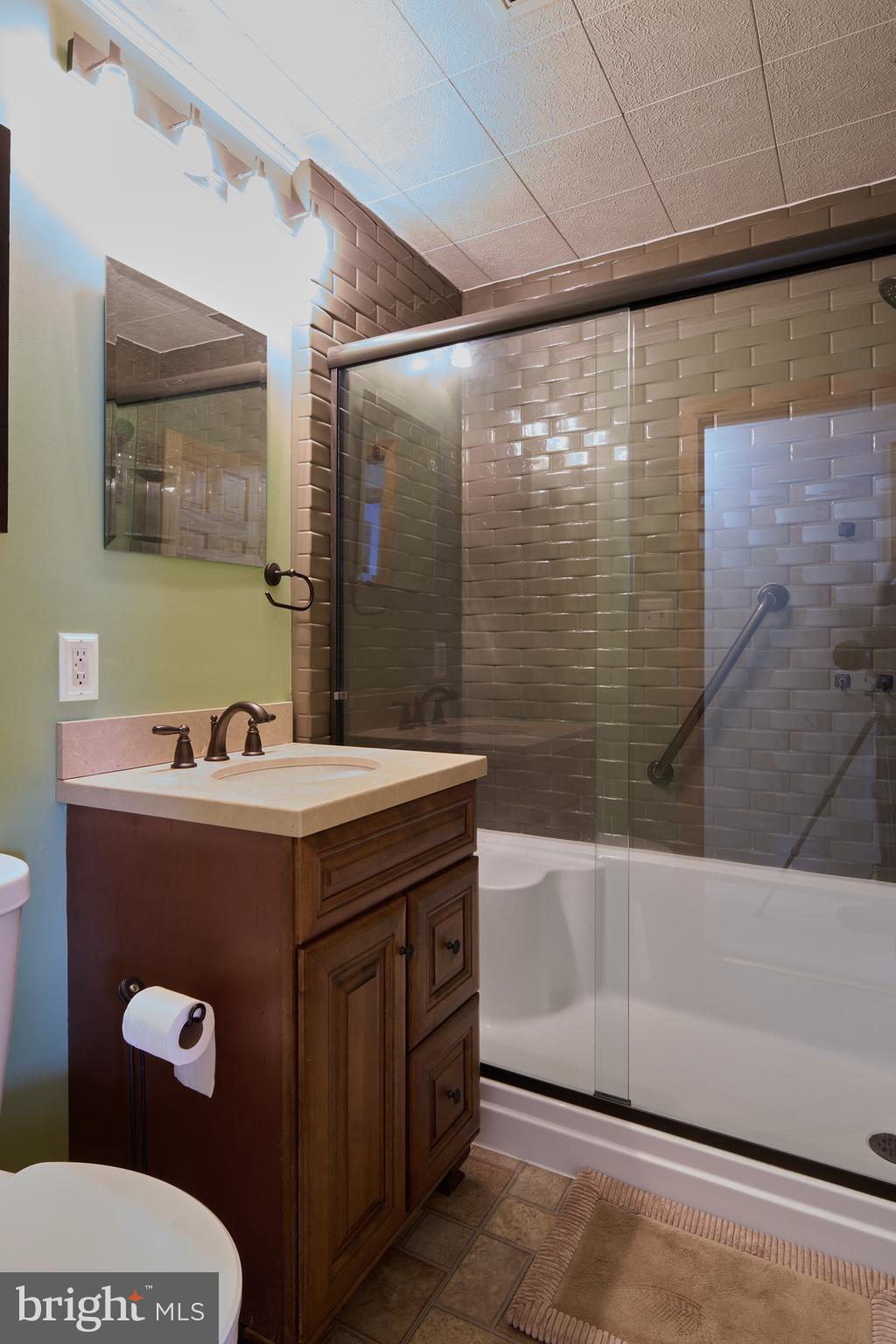 574 Buffalo Run Road Bellefonte, PA 16823 - Photo 42 of 54 a bathroom with a sink and mirror