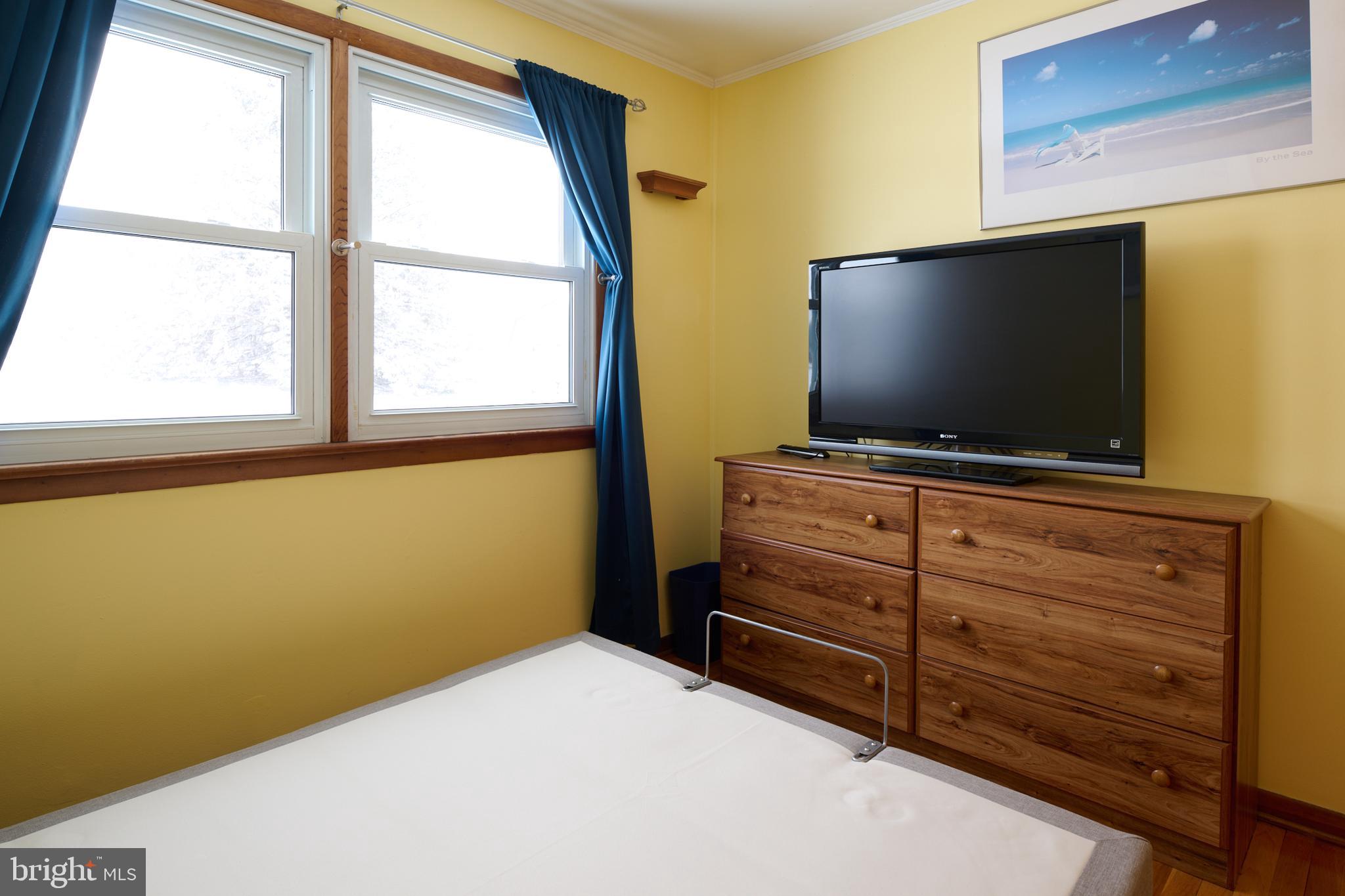 574 Buffalo Run Road Bellefonte, PA 16823 - Photo 44 of 54 a room with furniture and flat screen tv