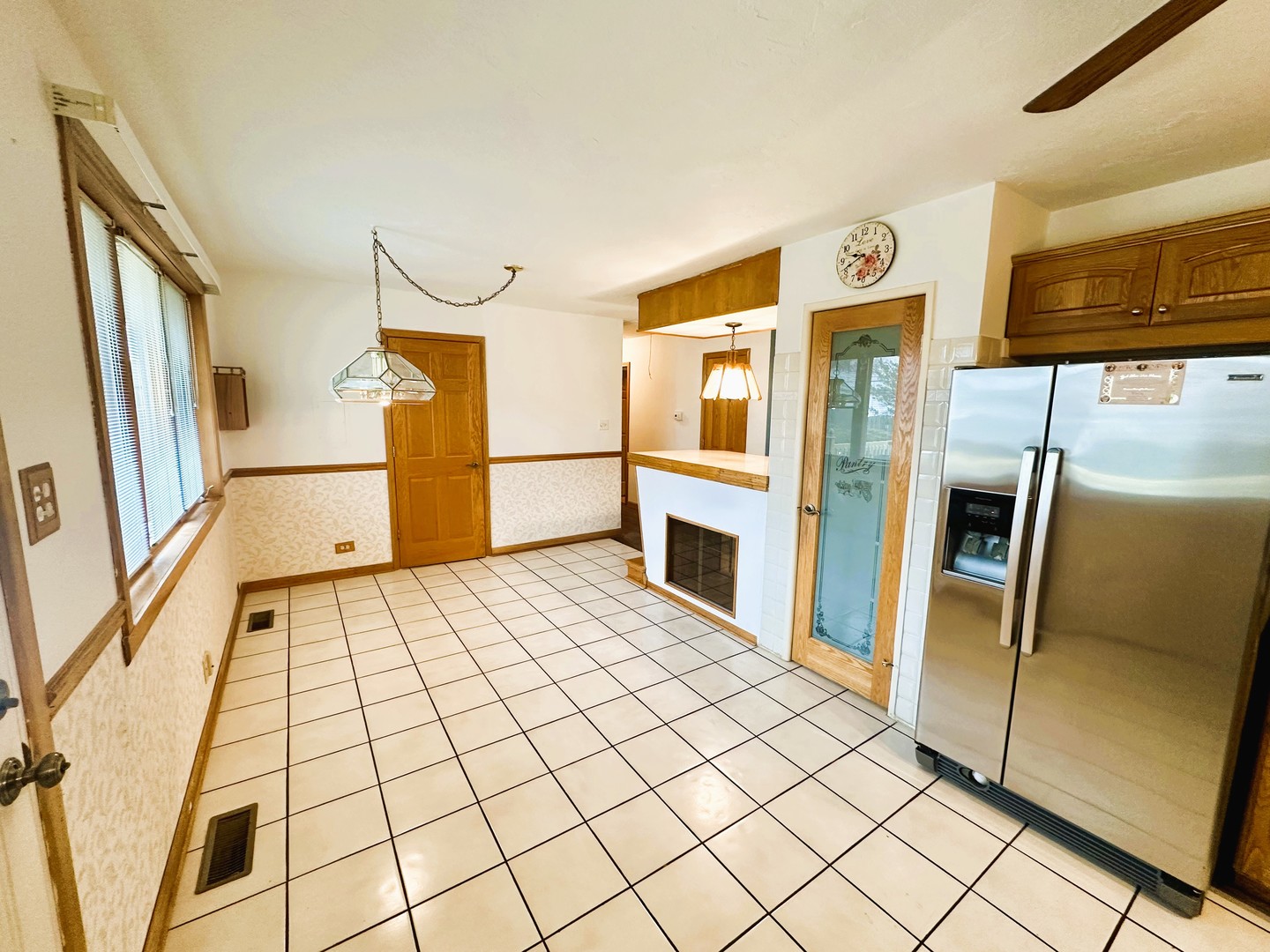 9112 Homestead Lane Bridgeview, IL 60455 - Photo 12 of 29 a kitchen with a refrigerator and microwave