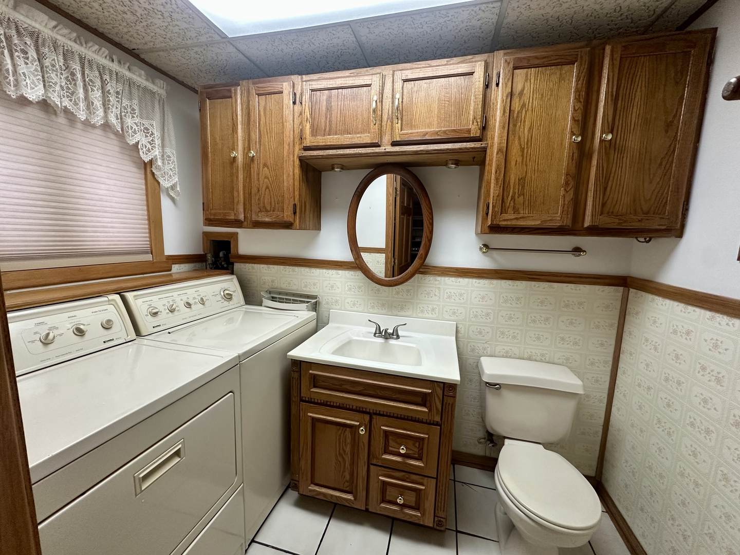 9112 Homestead Lane Bridgeview, IL 60455 - Photo 14 of 29 a bathroom with a granite countertop toilet sink and mirror