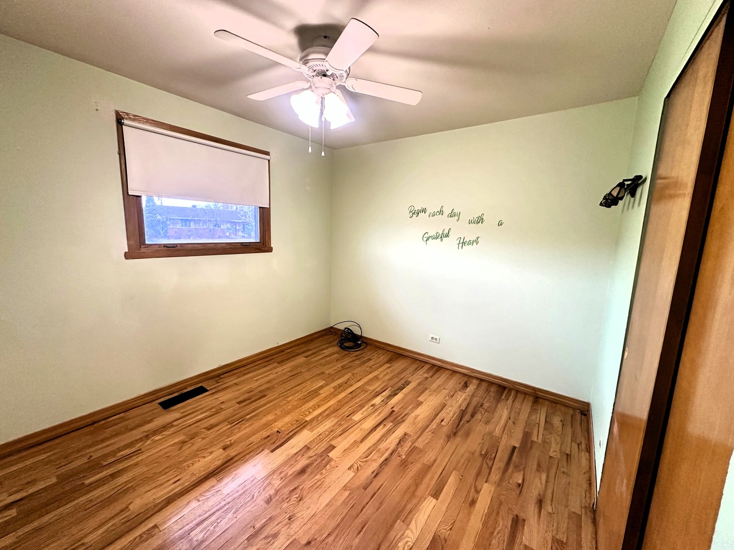 9112 Homestead Lane Bridgeview, IL 60455 - Photo 15 of 29 wooden floor in an empty room with a window