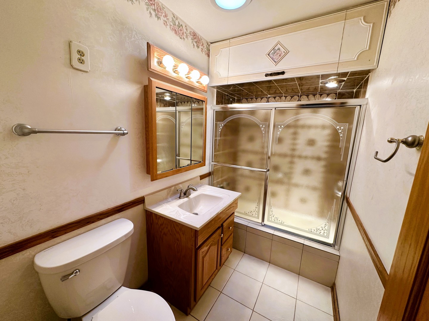 9112 Homestead Lane Bridgeview, IL 60455 - Photo 19 of 29 a bathroom with a sink mirror vanity and toilet