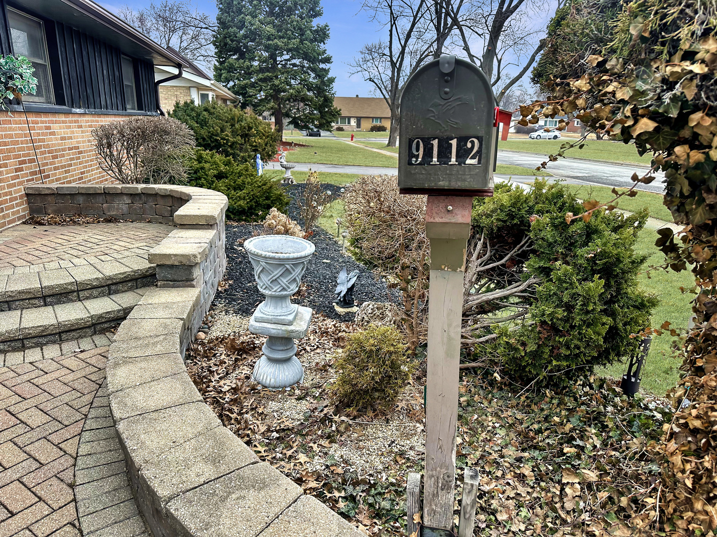 9112 Homestead Lane Bridgeview, IL 60455 - Photo 2 of 29 a front view of a house with garden
