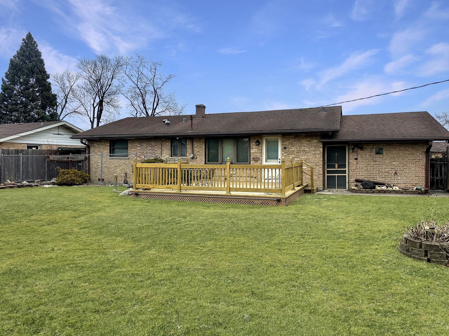 9112 Homestead Lane Bridgeview, IL 60455 - Photo 27 of 29 a front view of a house with a garden and trees