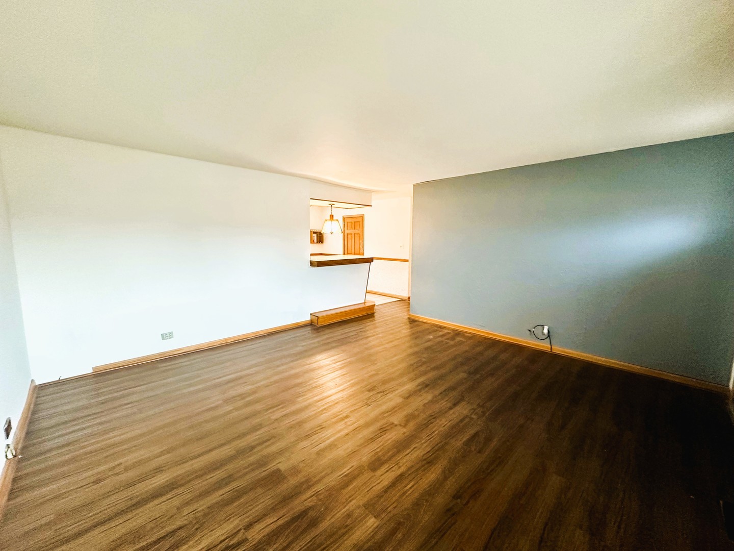9112 Homestead Lane Bridgeview, IL 60455 - Photo 5 of 29 a view of a room with wooden floor and white walls