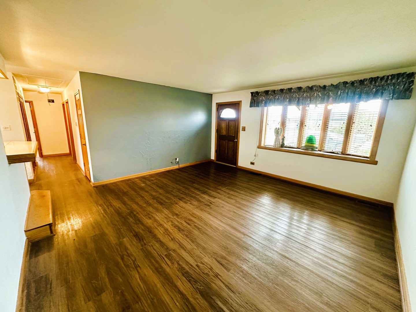 9112 Homestead Lane Bridgeview, IL 60455 - Photo 6 of 29 a view of an empty room with window and wooden floor