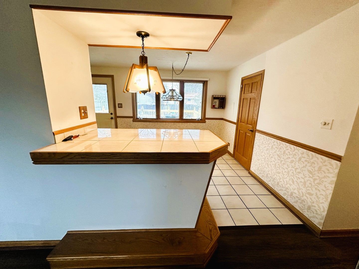 9112 Homestead Lane Bridgeview, IL 60455 - Photo 8 of 29 a view of a balcony with furniture and wooden floor