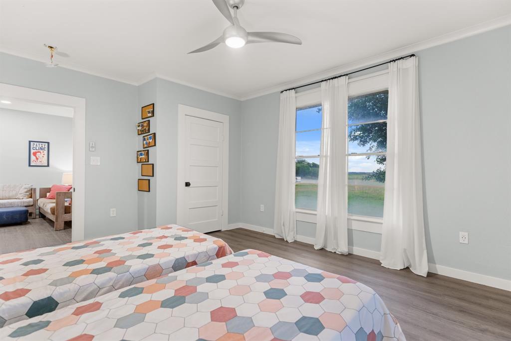 300 Grellhesl Road West, TX 76691 - Photo 23 of 35 a bedroom with a bed and a dresser