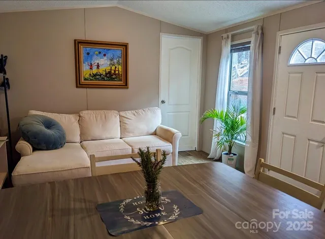 a kitchen with stainless steel appliances granite countertop a stove and a refrigerator