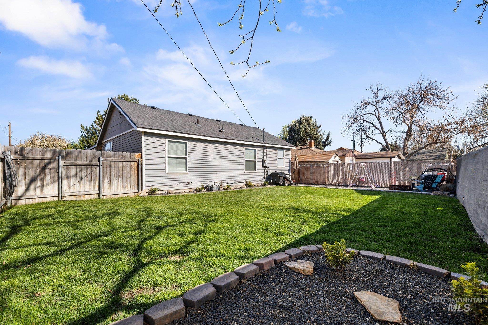 1504 2nd Street North Nampa, ID 83687 - Photo 25 of 29 Back of property with a fenced backyard