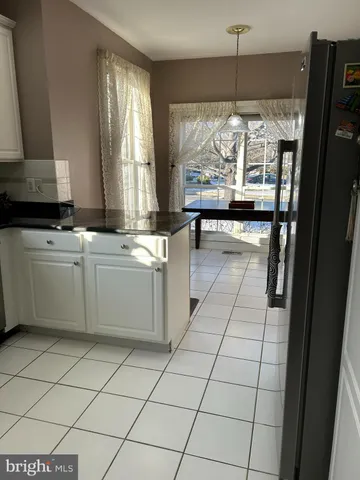 a kitchen with stainless steel appliances a stove a sink and a refrigerator