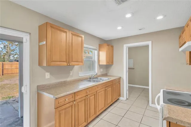 a kitchen with a sink and cabinets