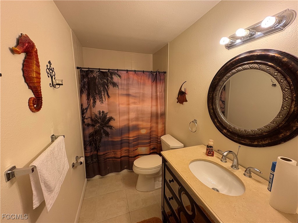 1830 Brantley Road, Unit J1 Fort Myers, FL 33907 - Photo 12 of 39 a bathroom with a sink a toilet and shower
