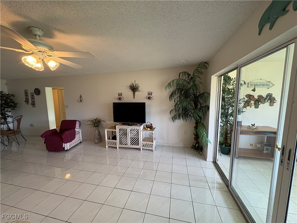 1830 Brantley Road, Unit J1 Fort Myers, FL 33907 - Photo 16 of 39 a living room with furniture and a flat screen tv