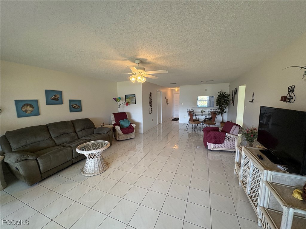 1830 Brantley Road, Unit J1 Fort Myers, FL 33907 - Photo 17 of 39 a living room with furniture and a flat screen tv