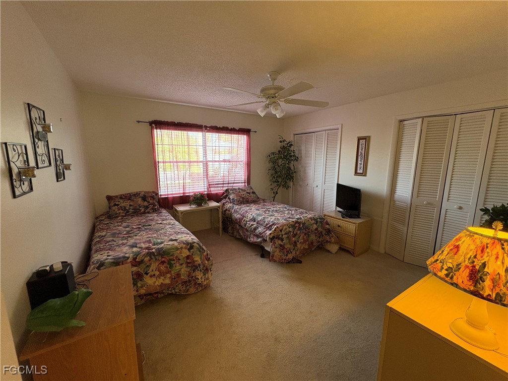 1830 Brantley Road, Unit J1 Fort Myers, FL 33907 - Photo 19 of 39 a bedroom with bed and window