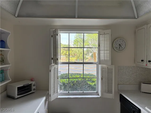 a view of a livingroom with furniture and window