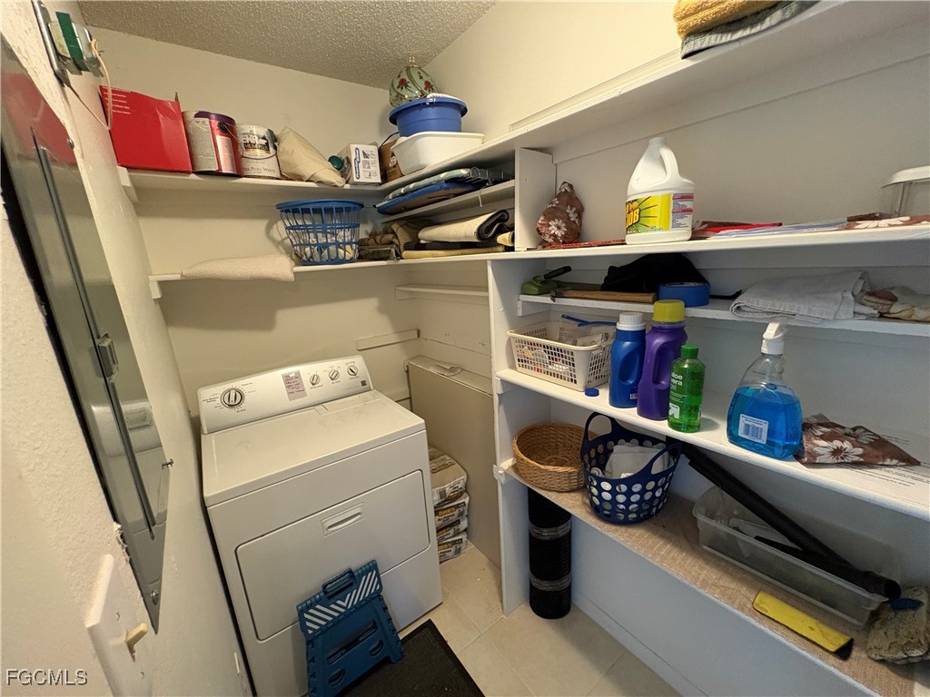 1830 Brantley Road, Unit J1 Fort Myers, FL 33907 - Photo 26 of 39 a storage room with washer and dryer