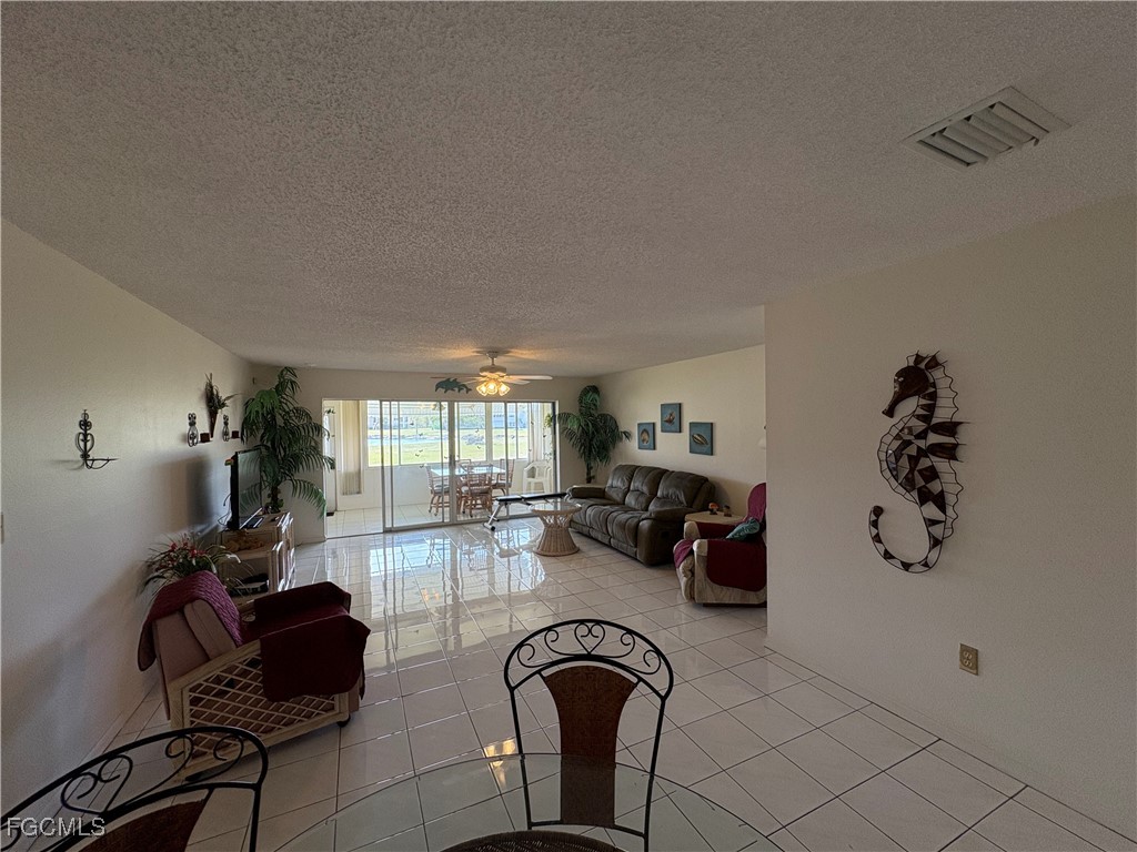 1830 Brantley Road, Unit J1 Fort Myers, FL 33907 - Photo 7 of 39 a view of a livingroom with furniture and lounge chair