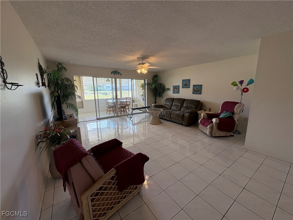 1830 Brantley Road, Unit J1 Fort Myers, FL 33907 - Photo 10 of 39 a living room with furniture and a large window