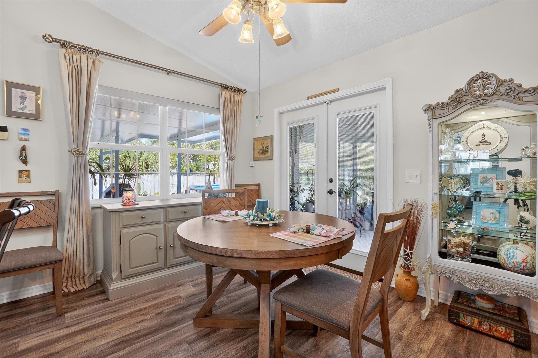 229 Yale Road St. Augustine, FL 32086 - Photo 11 of 47 Dining area featuring french doors, a ceiling fan, dark wood finished floors, and lofted ceiling