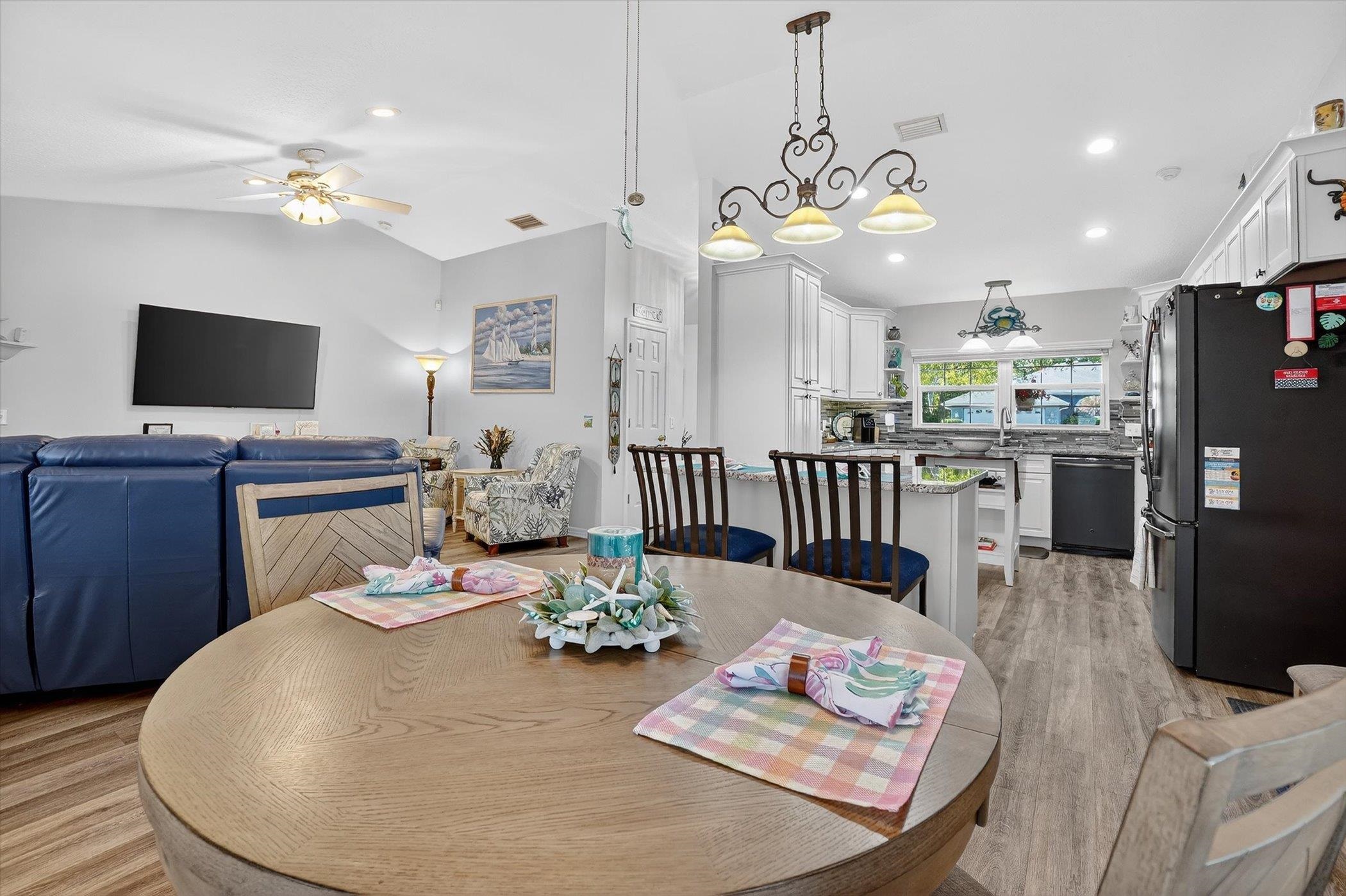 229 Yale Road St. Augustine, FL 32086 - Photo 13 of 47 Dining space with a ceiling fan, light wood-style flooring, vaulted ceiling, and recessed lighting