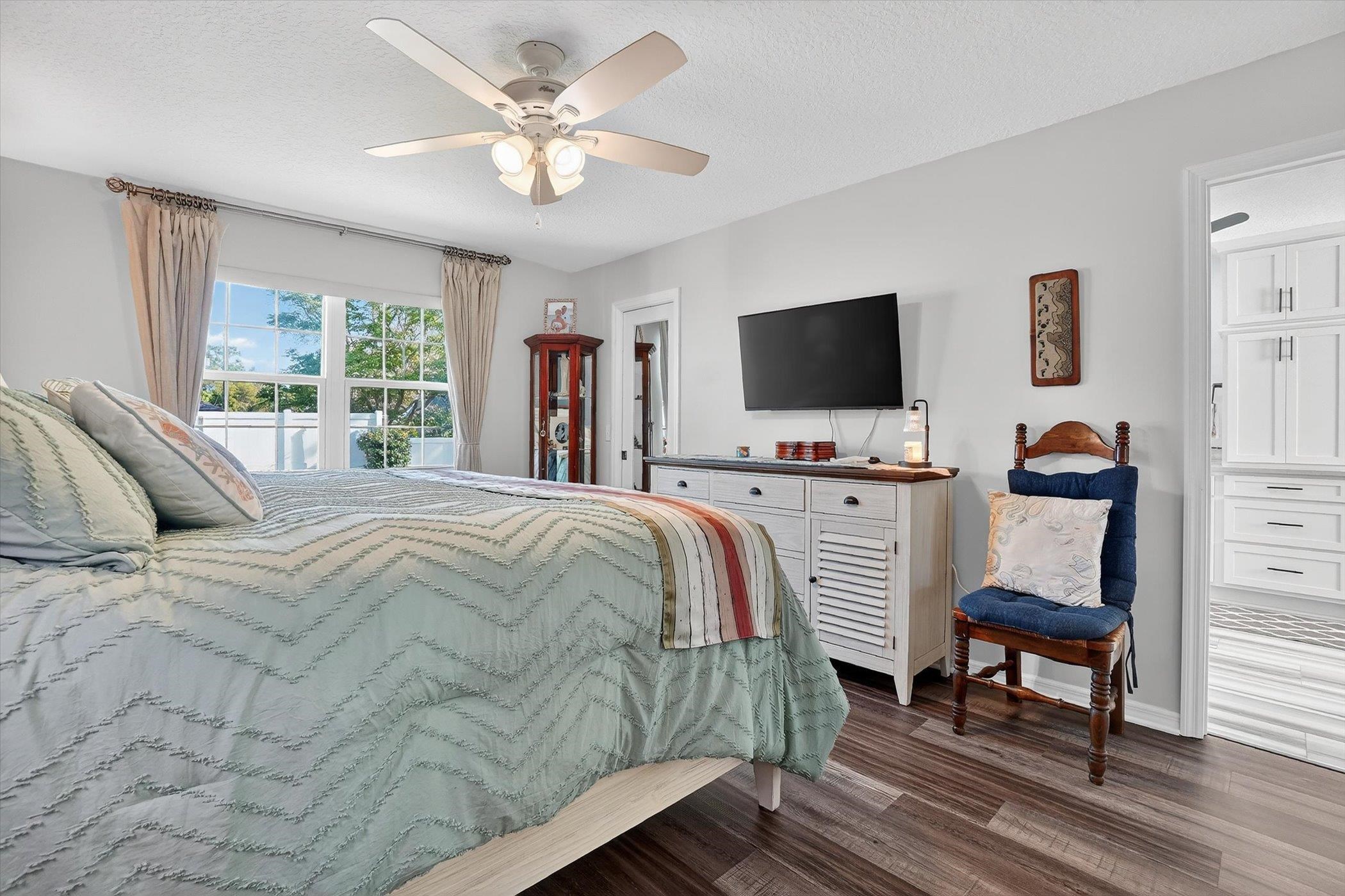 229 Yale Road St. Augustine, FL 32086 - Photo 14 of 47 Bedroom featuring dark wood finished floors, a ceiling fan, and a textured ceiling