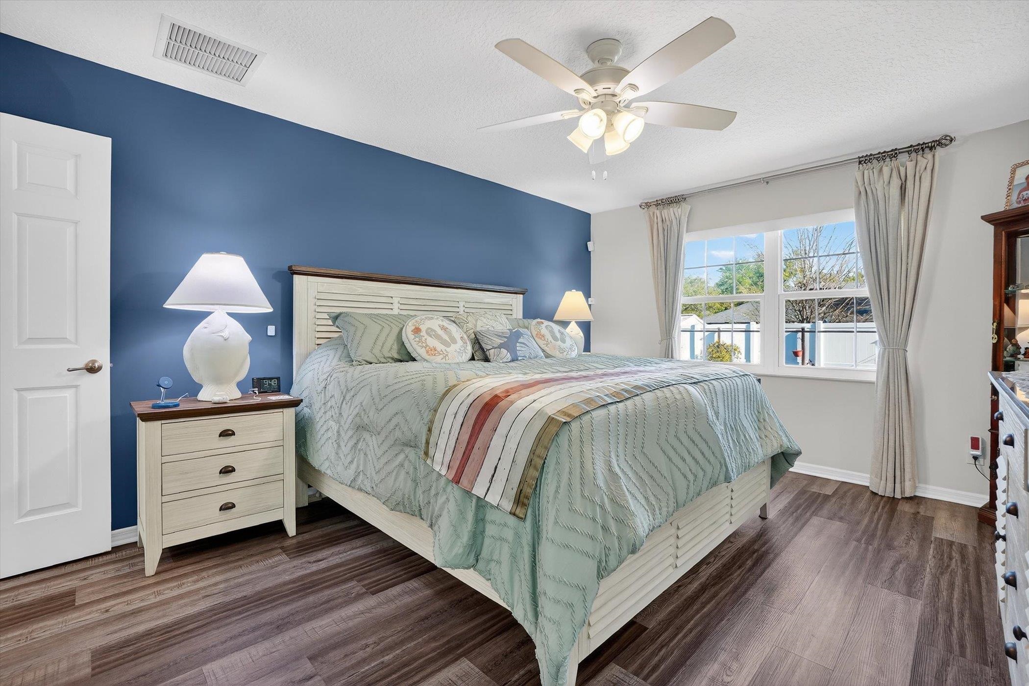 229 Yale Road St. Augustine, FL 32086 - Photo 15 of 47 Bedroom with dark wood-style floors, ceiling fan, and a textured ceiling